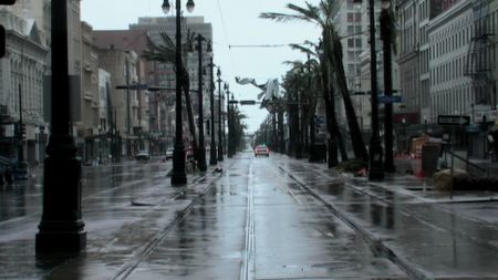 A police car drives through the empty streets of New Orleans after Hurricane Katrina. (Neil Alexander)