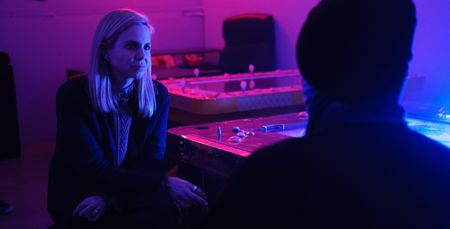 Mariana van Zeller interviews B in his hidden gambling location. (National Geographic for Disney)