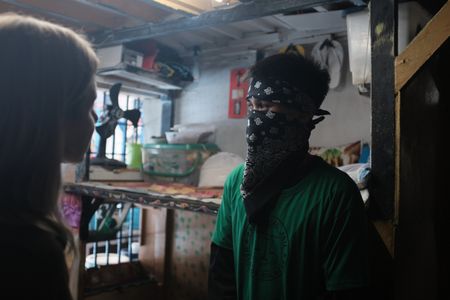 Mariana van Zeller discusses sextortion with Diego in a jail in Bulacan. (National Geographic for Disney)