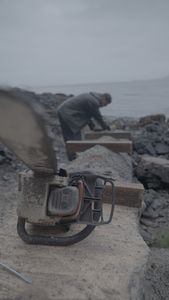 David Squibb helps construct a ramp on his neighbor's property. (National Geographic/Gil Cano)