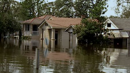 A residential street in New Orleans is flooded by Hurricane Katrina. (CNN)