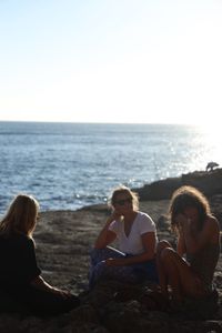 Mariana van Zeller sits with her best friend and cousin on the coast of Portugal. (National Geographic for Disney)