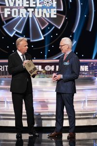 PAT SAJAK, TIM GUNN