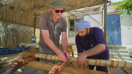 Allesandro Ghido and Ayaz Khalid Abulqader Al Zadjali build an experimental boat in Qantab, Oman. (Windfall Films)