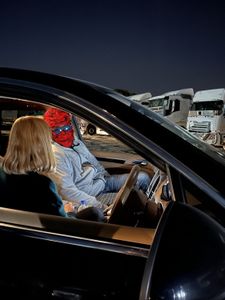Mariana van Zeller talks to Chris in a car. (National Geographic for Disney)