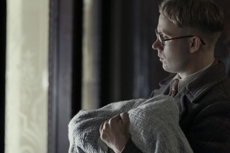 A SMALL LIGHT - Jan Gies, played by Joe Cole, fetches an important package as seen in A SMALL LIGHT. (Credit: National Geographic for Disney/Dusan Martincek)