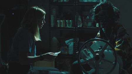 Mariana interviews Sai at his pill press site. (Photo credit: National Geographic)