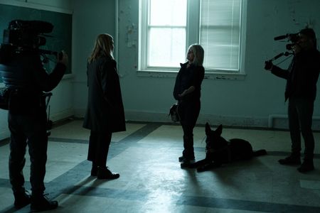 Mariana van Zeller watches Lisa's trained dog search a room. (National Geographic for Disney)