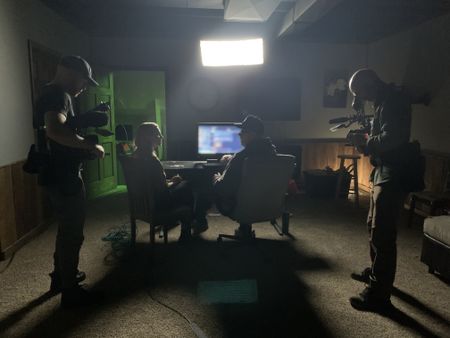 Mariana Van Zeller sits with Robert in his "command center." (National Geographic)