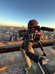 Crew film Mariana van Zeller and Ben on a rooftop in Johannesburg. (National Geographic for Disney)